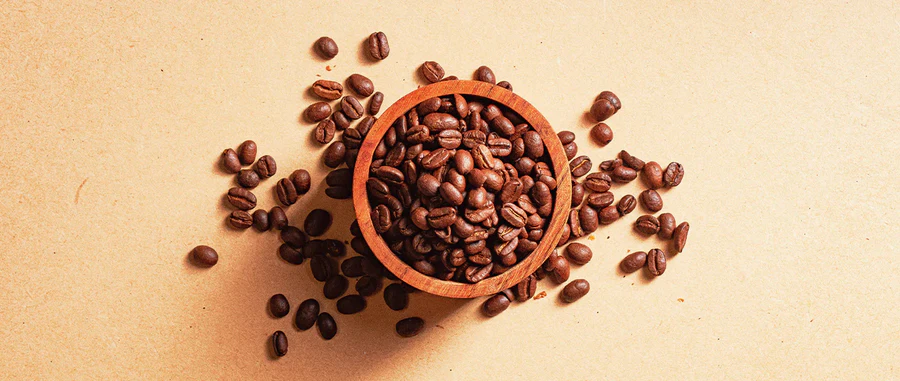 Our single-origin Colombian coffee beans in a timber bowl