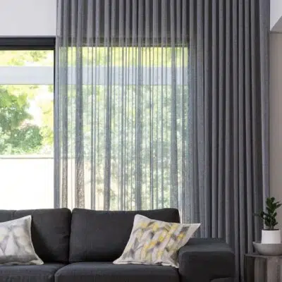 S-fold curtains across a living-room window