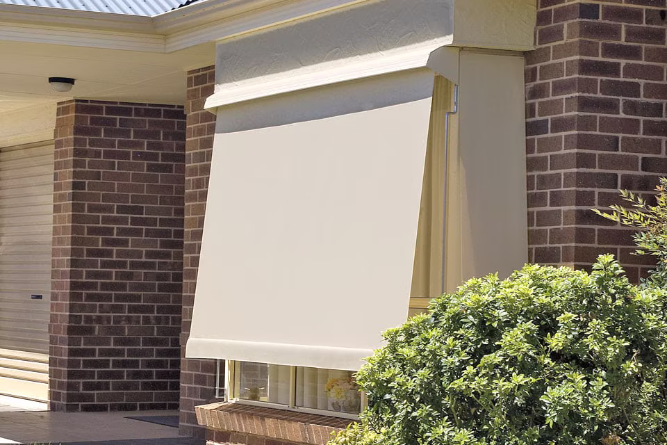Striped sunblind awning shading an exterior window