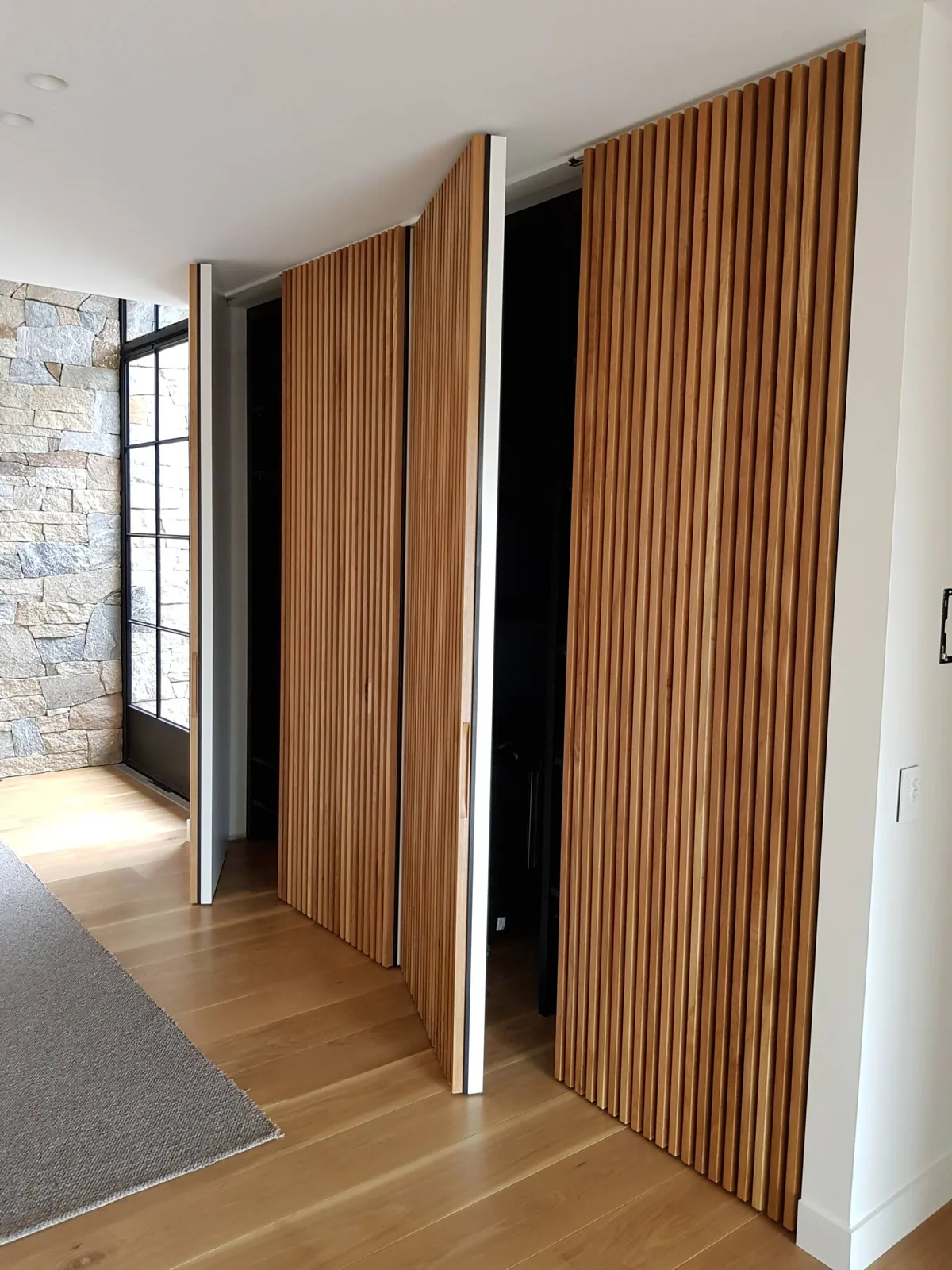 Clear-finished timber slats on wardrobe doors in one of our projects