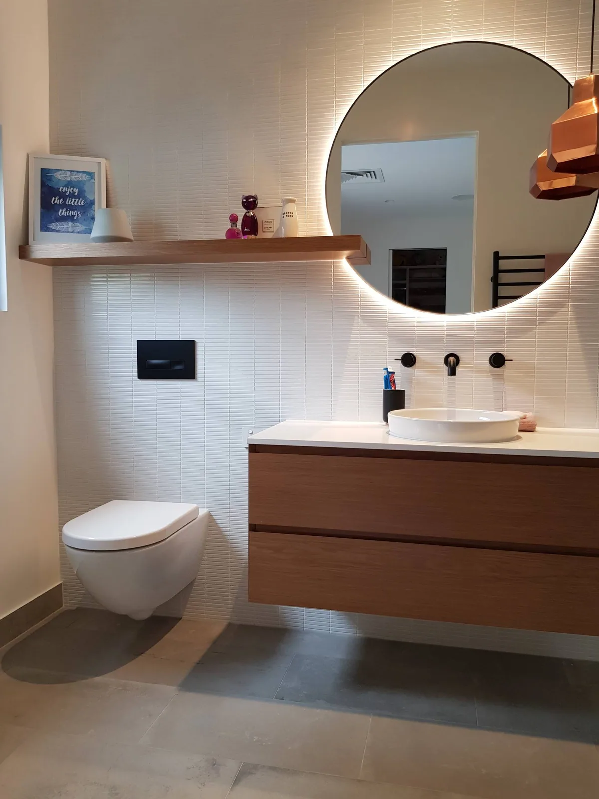 Veneer vanity cabinetry with a clear finish in one of our projects