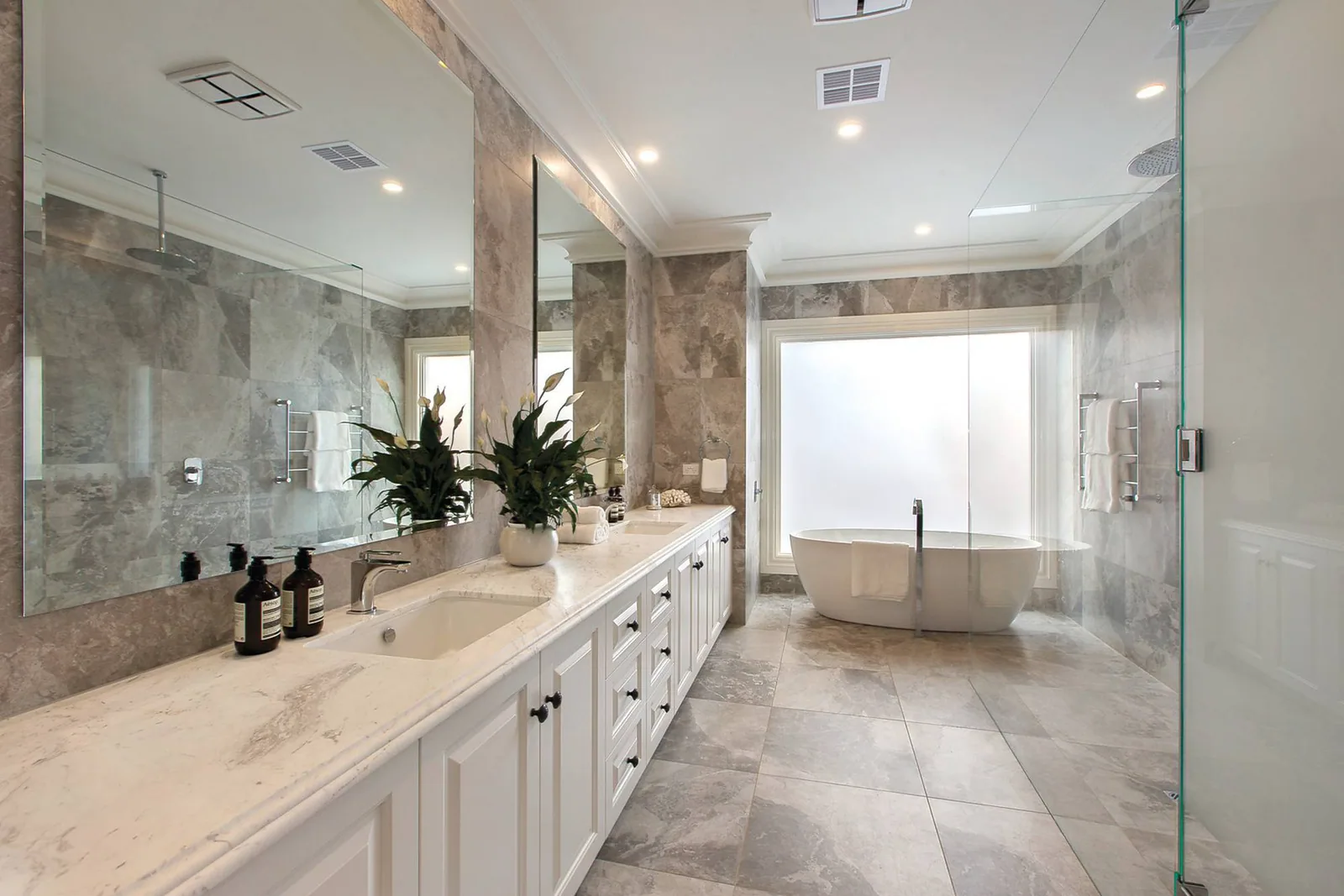White bathroom cabinetry in one of our finished residential projects