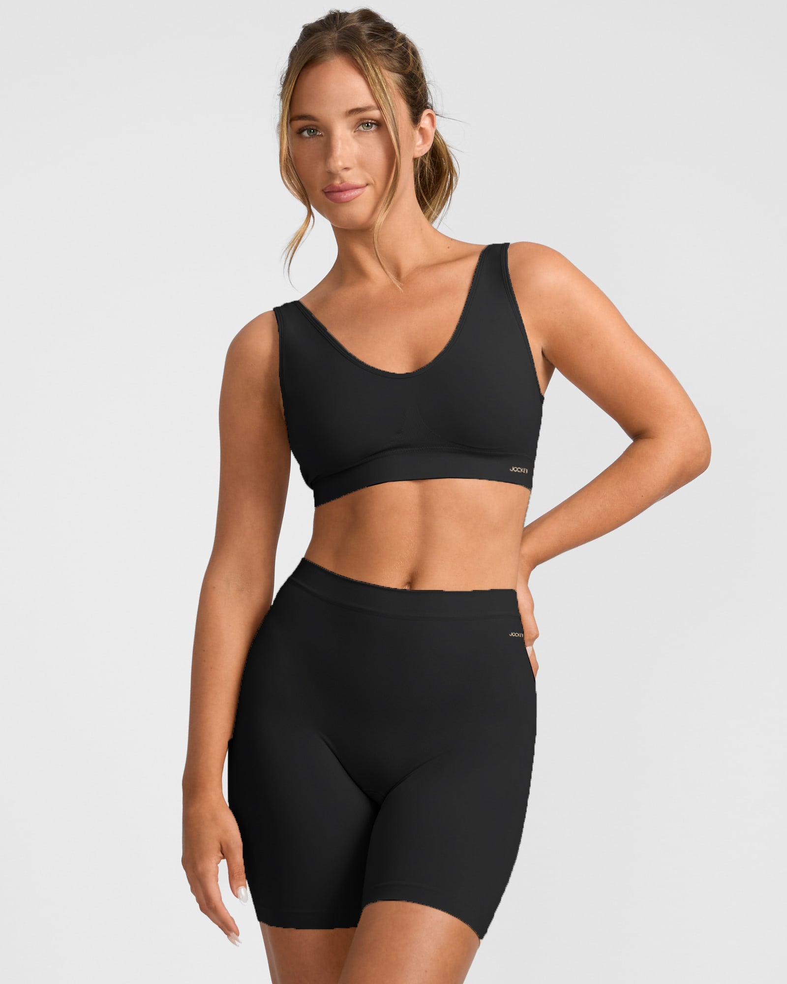 Woman wearing black Jockey Skimmies Smooth Long Short and crop