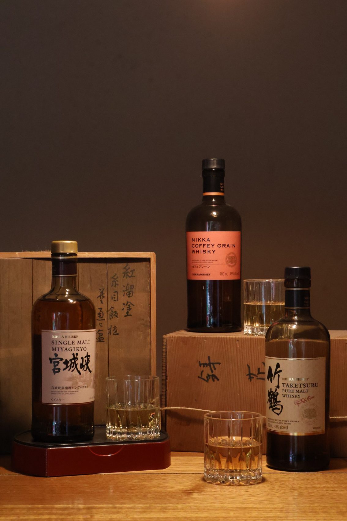 Japanese whisky bottles lined up on the bar