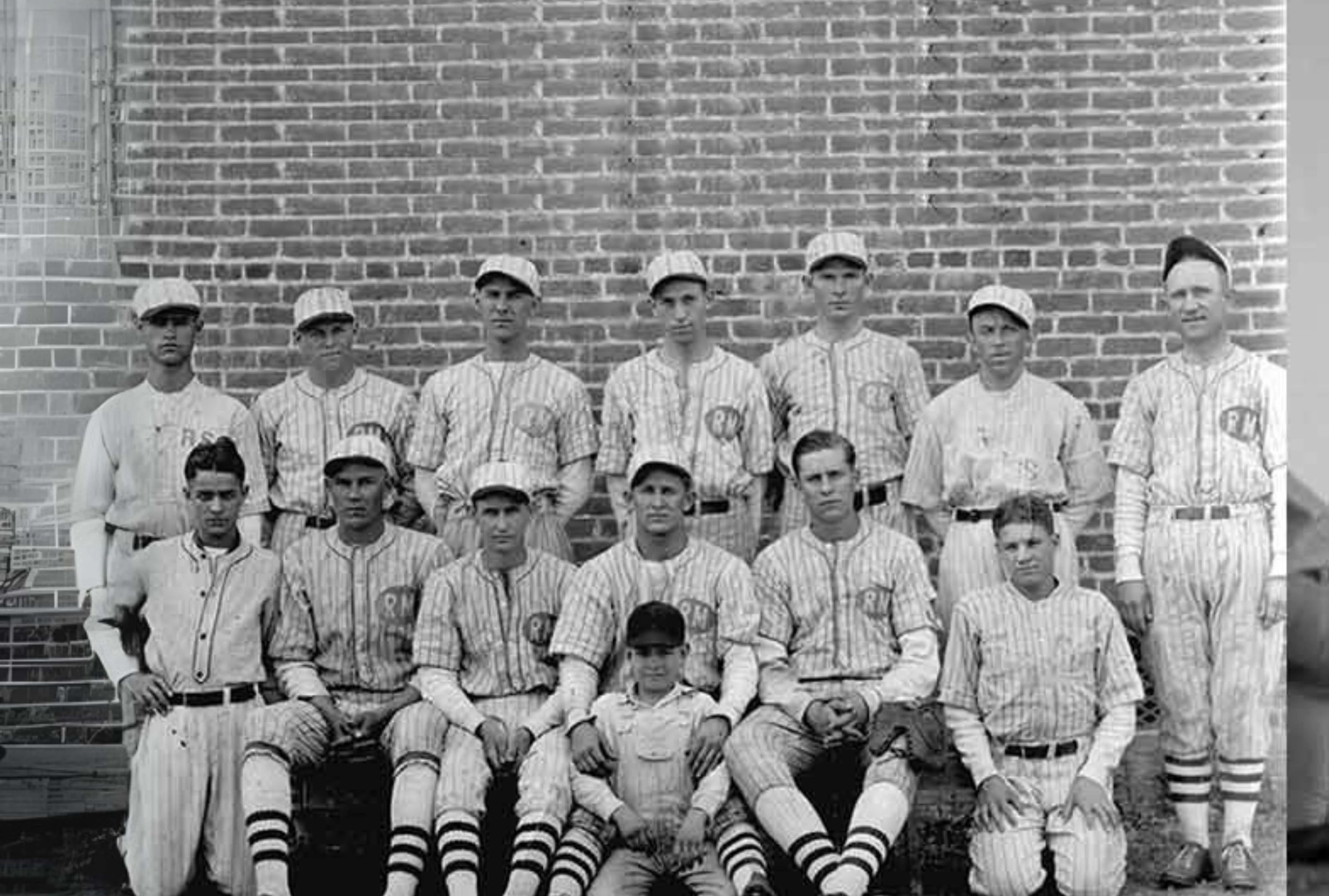 Historical Russell baseball team in striped uniforms