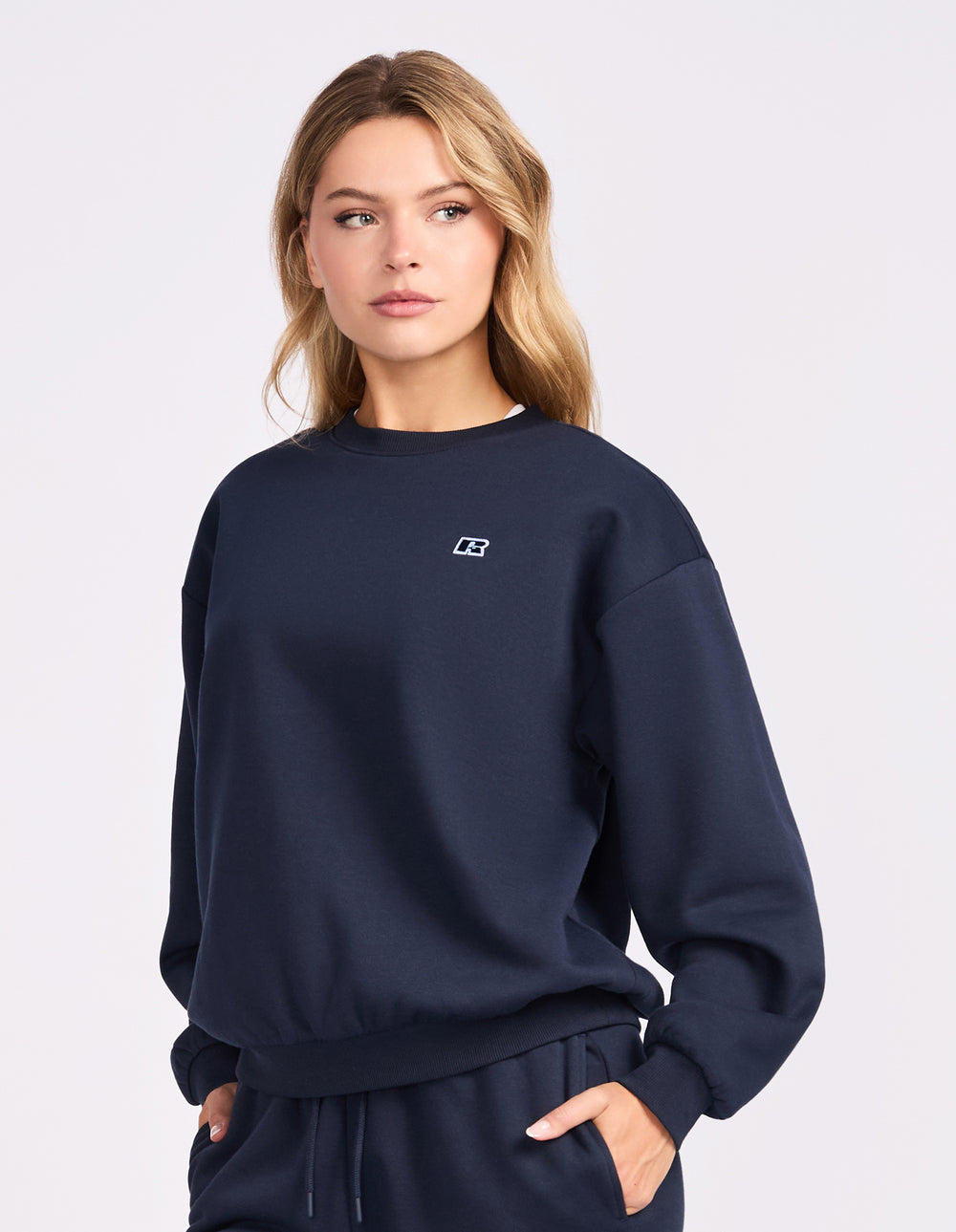Model wearing the Michigan Navy R Logo Fleece Women's Crew